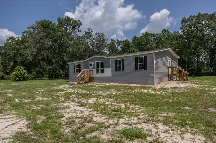 Front exterior of a new home in , Fort White, FL, highlighting curb appeal (Image 19).