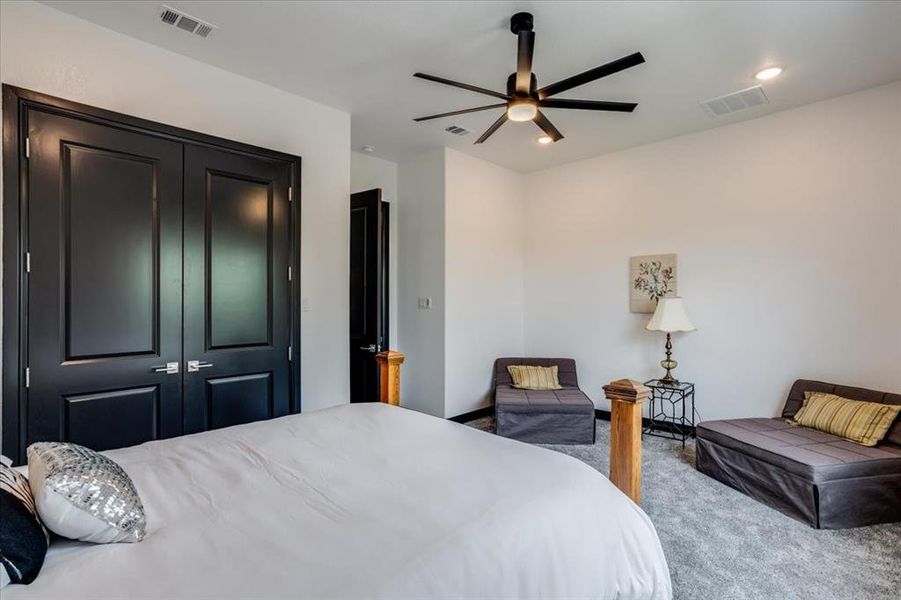 Bedroom with carpet, a closet, ceiling fan, and recessed lighting