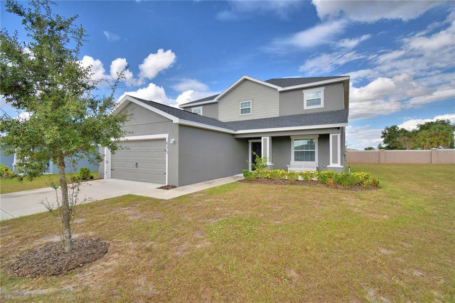 Front exterior of a new home in , Lake Wales, FL, highlighting curb appeal (Image 2). Front exterior of a new home in , Lake Wales, FL, highlighting curb appeal (Image 2).