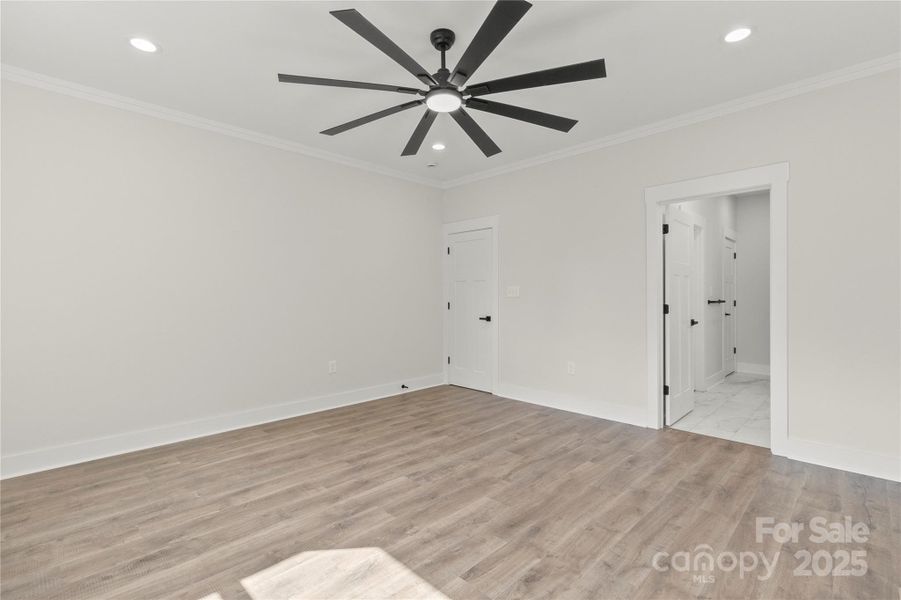 Primary bedroom looking at bathroom and entrance door