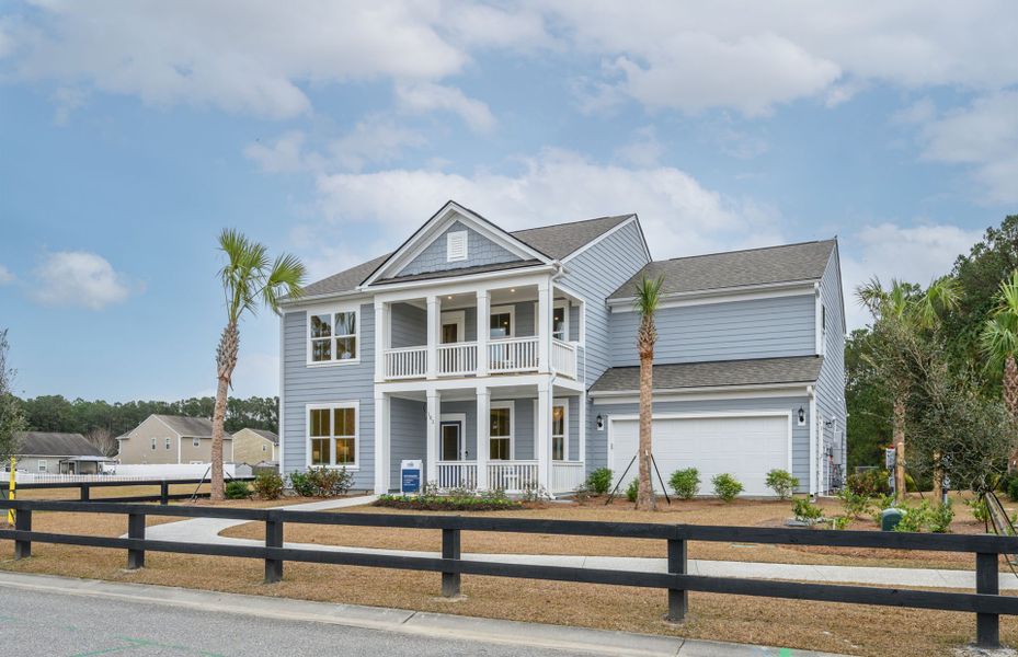 Front exterior of a new home in Midpoint at New Riverside, Bluffton, SC, highlighting curb appeal (Image 2). Front exterior of a new home in Midpoint at New Riverside, Bluffton, SC, highlighting curb appeal (Image 2).