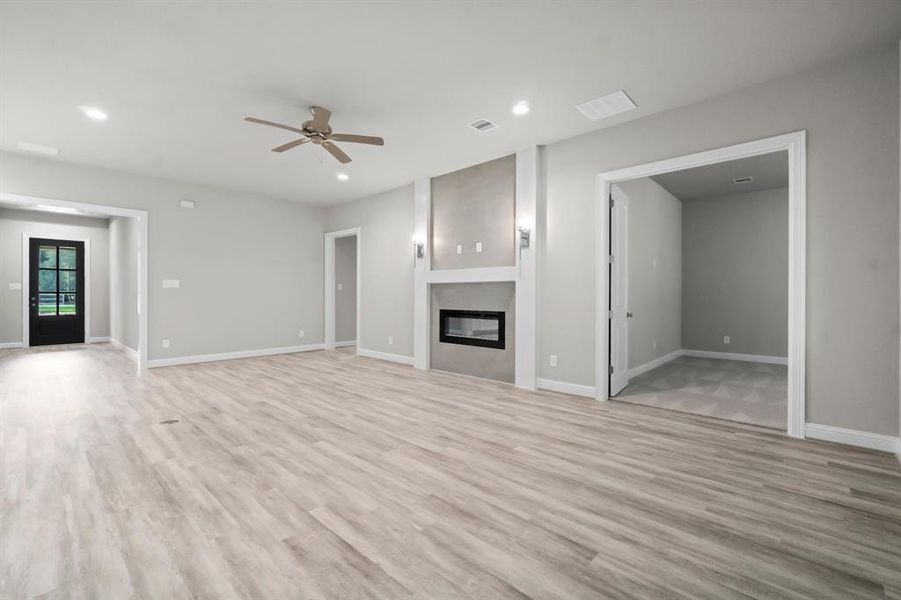 View of the family room, casual dining, and island.