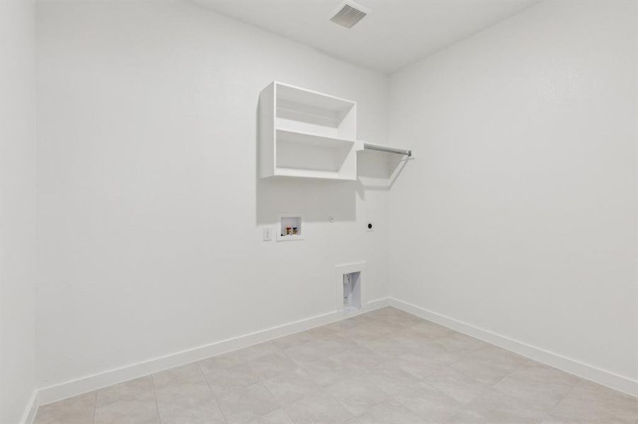 Utility in the Heisman home plan by Trophy Signature Homes – REPRESENTATIVE PHOTO