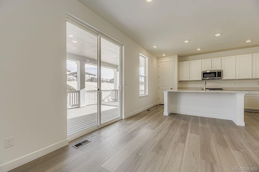 Spacious, unfurnished interior of a new home in Newlin Crossing: The Monarch Collection, Parker (Image 11).