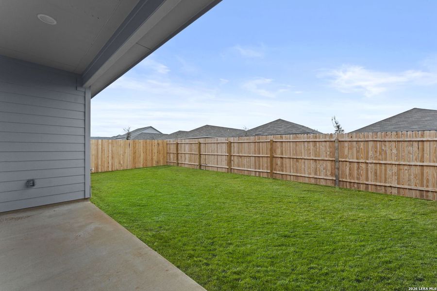 Exterior details and patio area of a home in Friendship Oaks, Fredericksburg (Image 2).