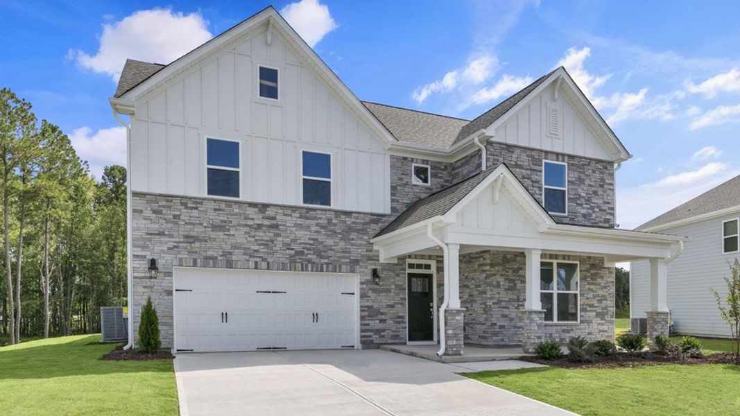 Representative exterior photo of a completed home built from the HARTWELL by D.R. Horton in Eagle Creek, Fuquay Varina, NC (Image 23).