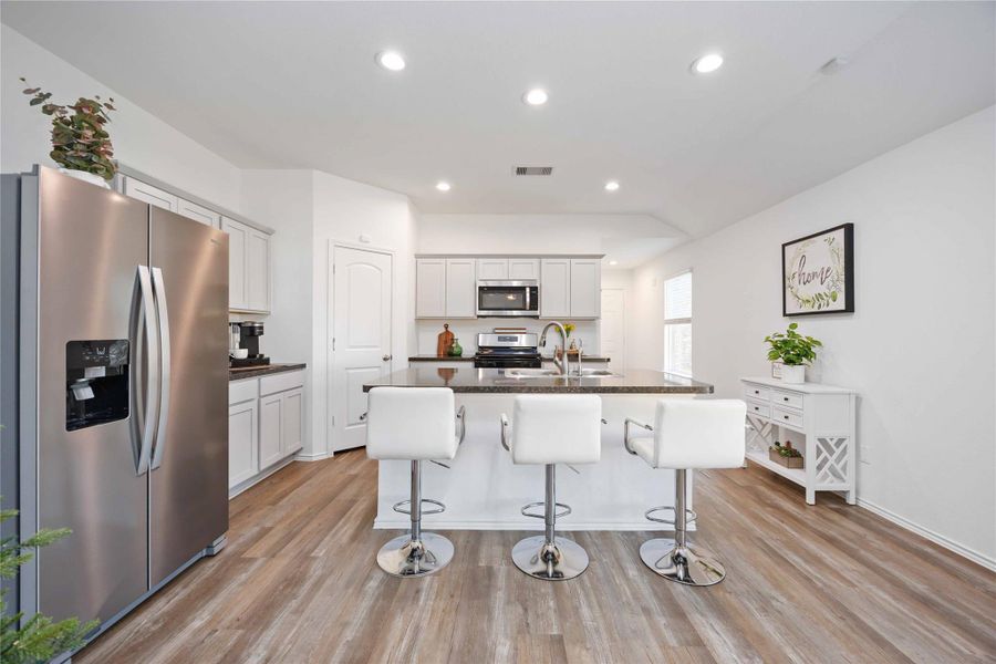 Kitchen – Entertaining ViewStylish and inviting kitchen centered around a generous island with seating, ideal for casual meals, conversations, or hosting guests. Clean lines, stainless steel appliances, and abundant cabinetry create a bright, functional space that naturally serves as the heart of the home, seamlessly connecting to the surrounding living areas. Kitchen – Entertaining ViewStylish and inviting kitchen centered around a generous island with seating, ideal for casual meals, conversations, or hosting guests. Clean lines, stainless steel appliances, and abundant cabinetry create a bright, functional space that naturally serves as the heart of the home, seamlessly connecting to the surrounding living areas.