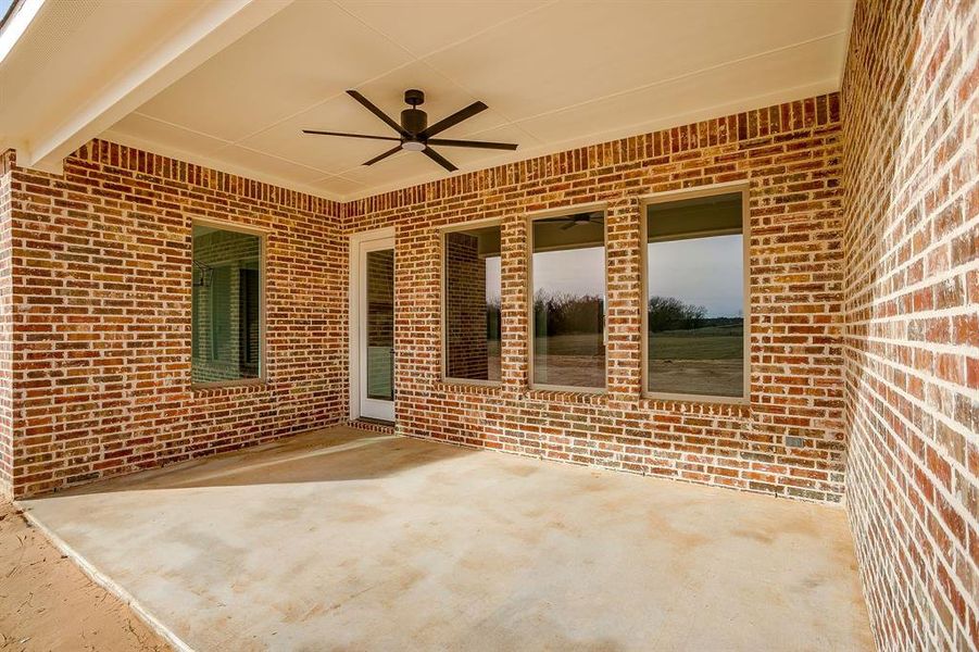 Exterior details and patio area of a home in , Poolville (Image 3).