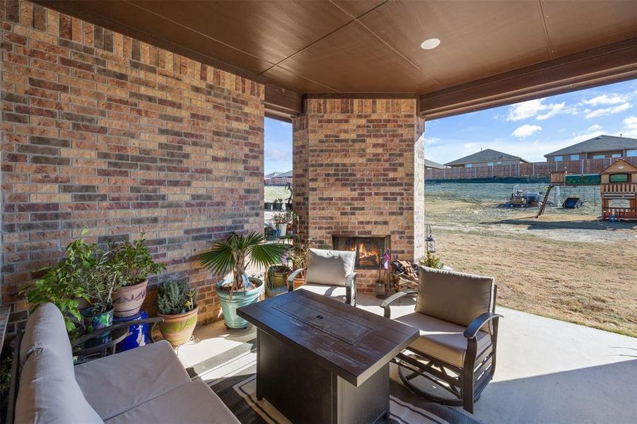 View of patio with an outdoor living space with a fireplace View of patio with an outdoor living space with a fireplace