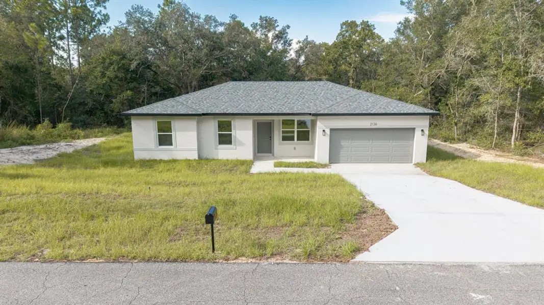 Front exterior of a new home in , Dunnellon, FL, highlighting curb appeal (Image 2). Front exterior of a new home in , Dunnellon, FL, highlighting curb appeal (Image 2).