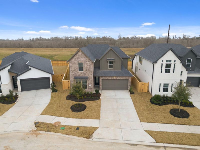 Front exterior of a new home in Sienna 45', 50', Missouri City, TX, highlighting curb appeal (Image 21).
