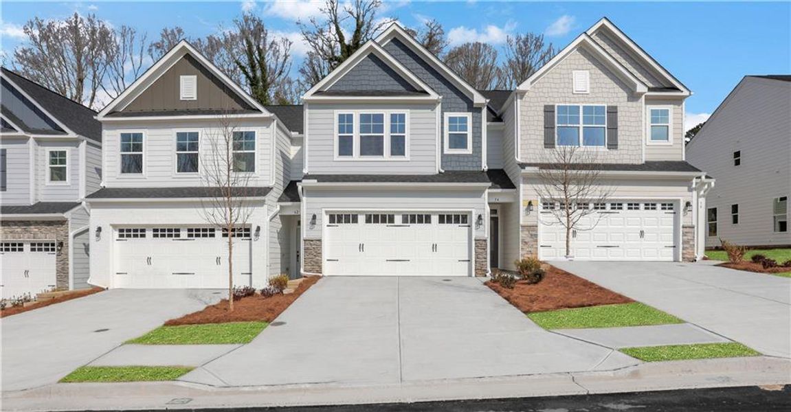 Front exterior of a new home in Villas at Dawsonville Townhomes, Dawsonville, GA, highlighting curb appeal (Image 2).