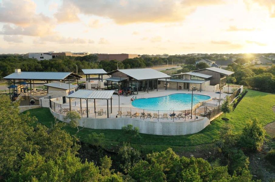 Pool at dusk with a patio