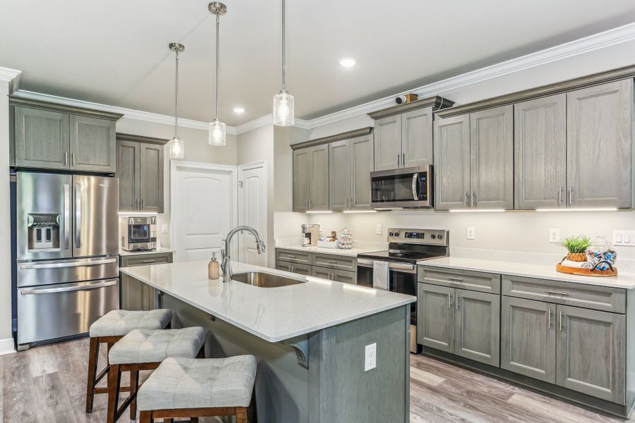 Representative furnished interior of a home built from the The Sapphire by Herbst Homes in Clear Water Landing, Milton (Image 68).