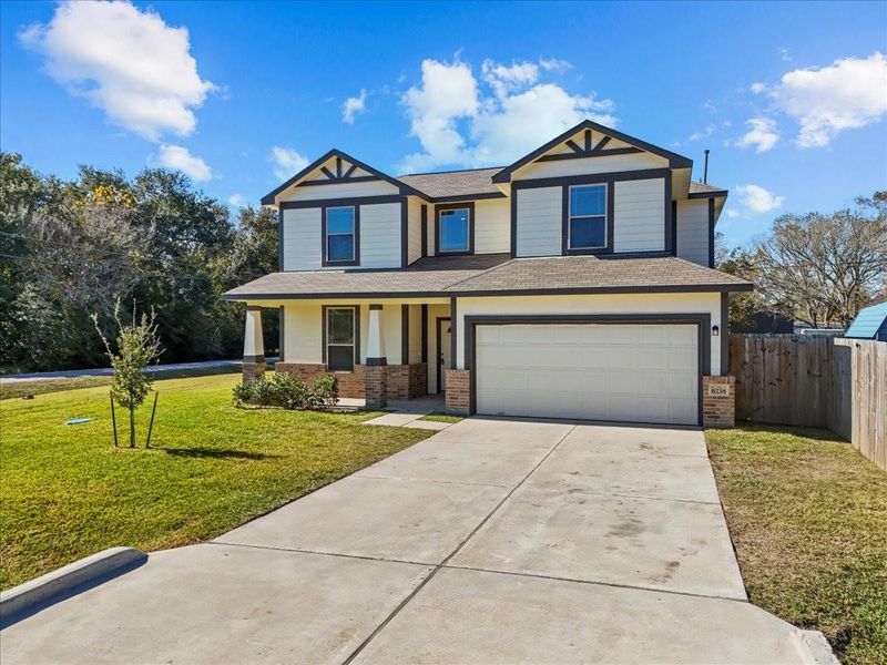 Front exterior of a new home in Mecom Way, Hitchcock, TX, highlighting curb appeal (Image 2). Front exterior of a new home in Mecom Way, Hitchcock, TX, highlighting curb appeal (Image 2).