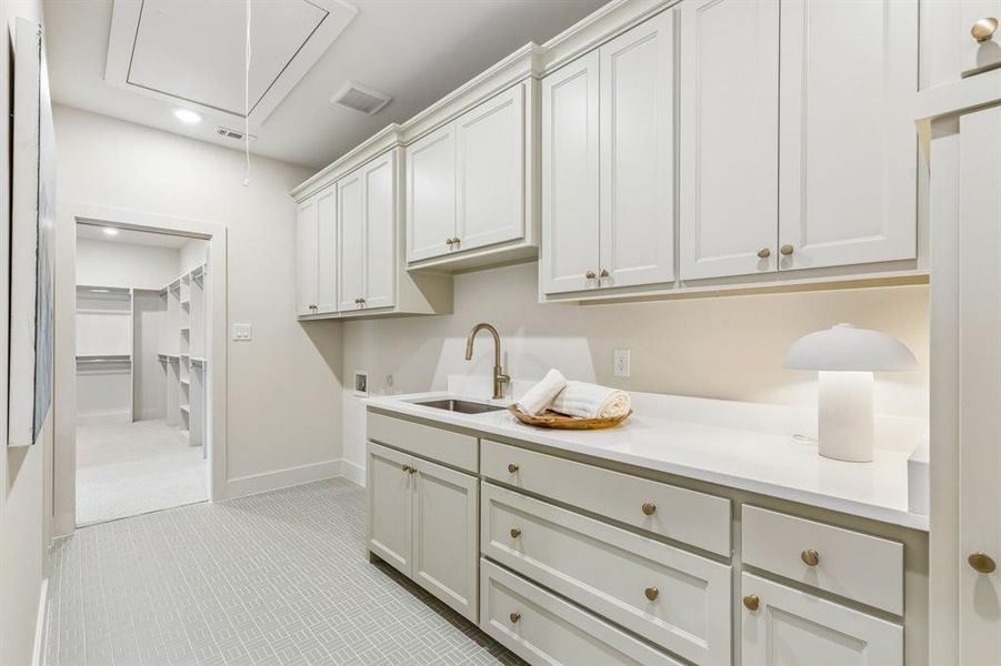 Laundry room, connects to primary closet