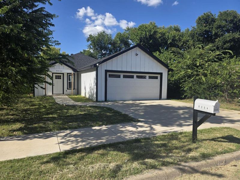 Front of house with a garage, board and batten siding, concrete driveway, Front of house with a garage, board and batten siding, concrete driveway,