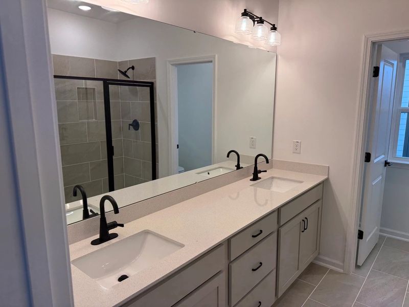 Primary Bath featuring the AW Collection® Artisan - A blend of artisan textures and calm, grounding colors. Primary Bath featuring the AW Collection® Artisan - A blend of artisan textures and calm, grounding colors.