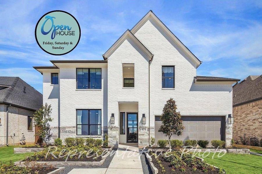 View of front of house featuring stone siding and brick siding