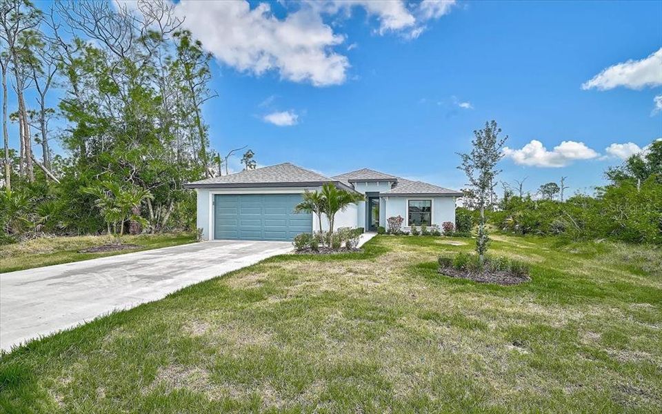 Front exterior of a new home in , Rotonda West, FL, highlighting curb appeal (Image 1). Front exterior of a new home in , Rotonda West, FL, highlighting curb appeal (Image 1).