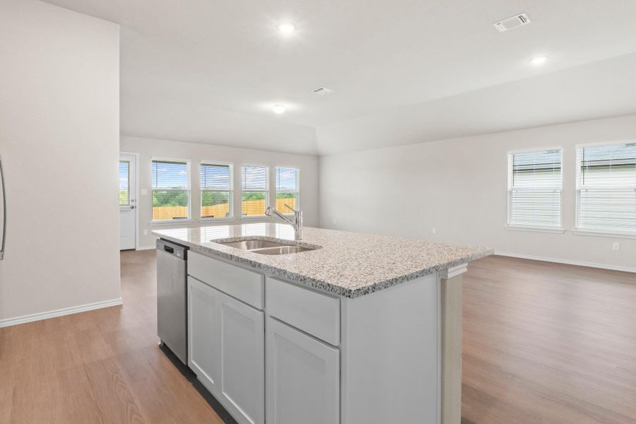 This kitchen offers a great flow into the dining area and the massive amount of natural light coming from the living room windows This kitchen offers a great flow into the dining area and the massive amount of natural light coming from the living room windows