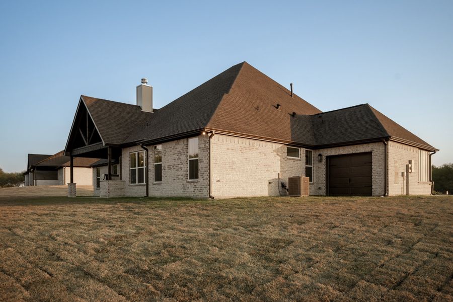 Exterior details and patio area of a home in Windmill Hill, Bryan (Image 37).
