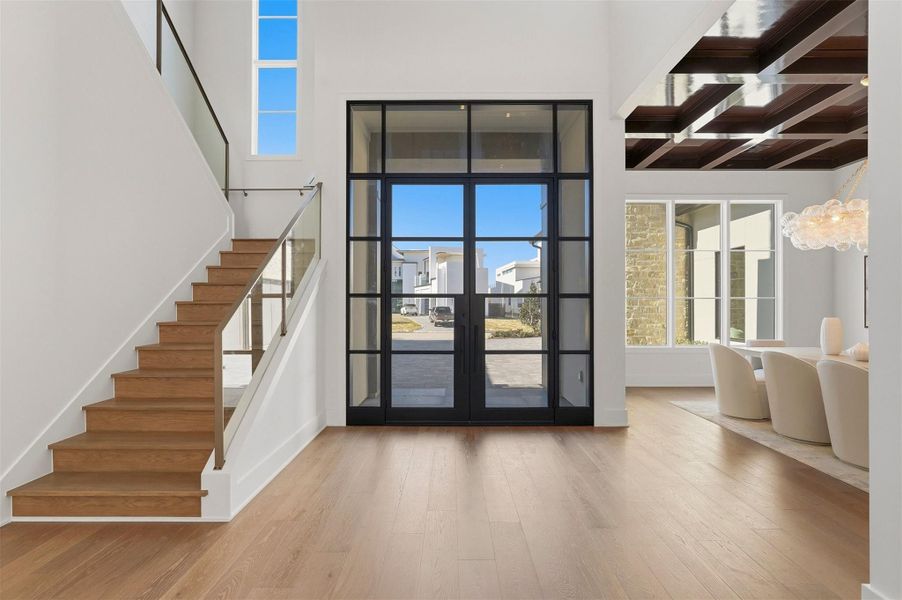 Just inside the double French steel doors, a two-story foyer for the most discerning design expert. Light wood flooring throughout your entire home in this open-concept floorpan. Just inside the double French steel doors, a two-story foyer for the most discerning design expert. Light wood flooring throughout your entire home in this open-concept floorpan.