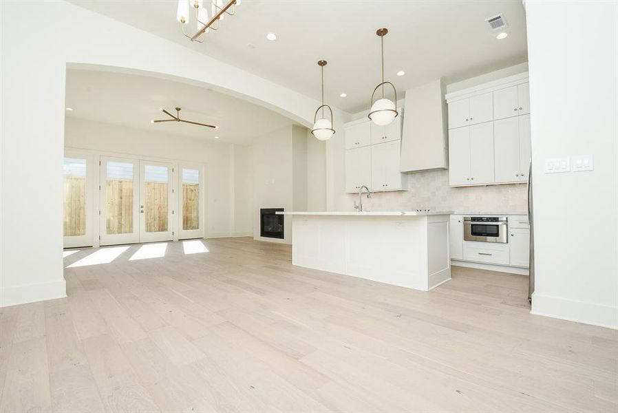 Open floor plan with engineered white oak hardwood flooring throughout.