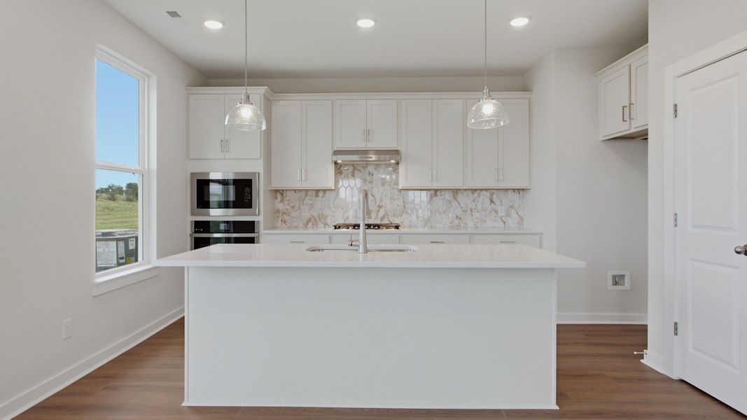Kitchen with island and convenient pantry door Kitchen with island and convenient pantry door