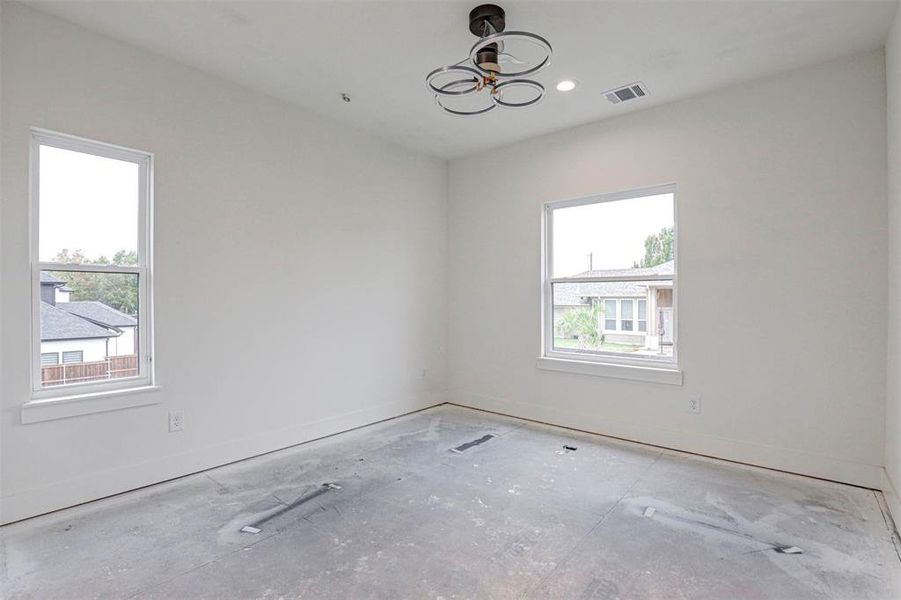 Bedroom featuring a wealth of natural light