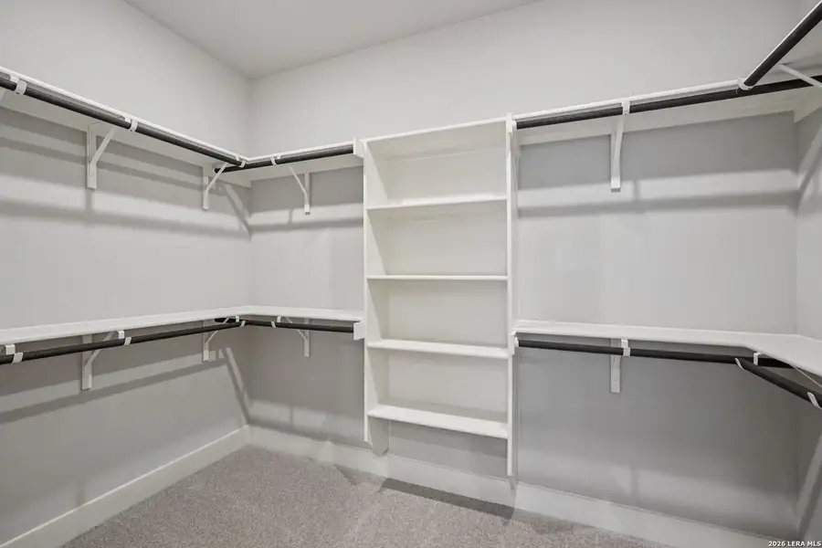 Spacious, unfurnished interior of a new home in Estancia Ranch - Premier Series, San Antonio (Image 24).