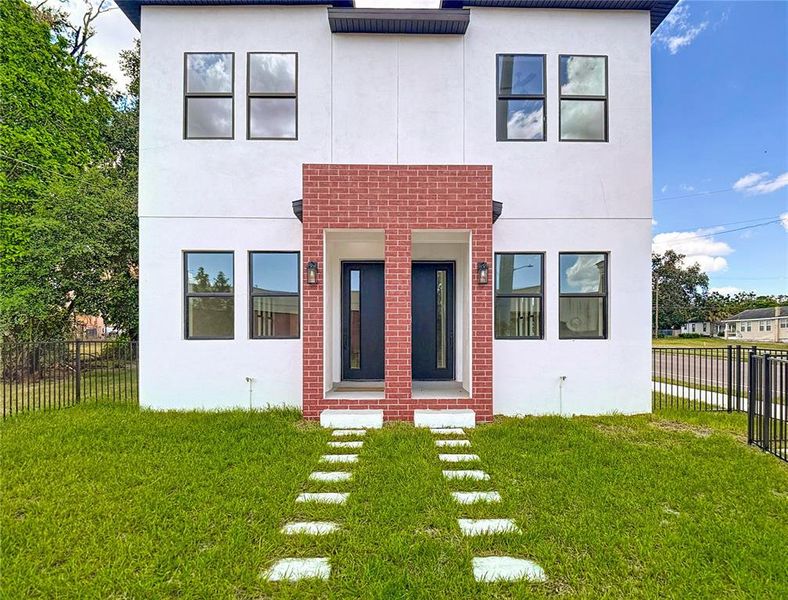 Front exterior of a new home in , Tampa, FL, highlighting curb appeal (Image 2).