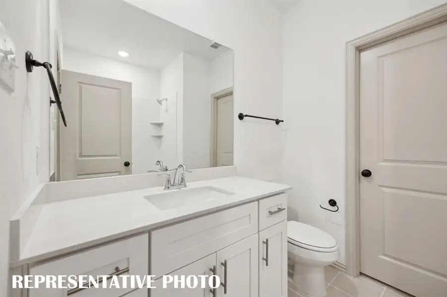 You'll find a beautifully finished main floor ensuite bath in our Elizabeth plan.  REPRESENTATIVE PHOTO