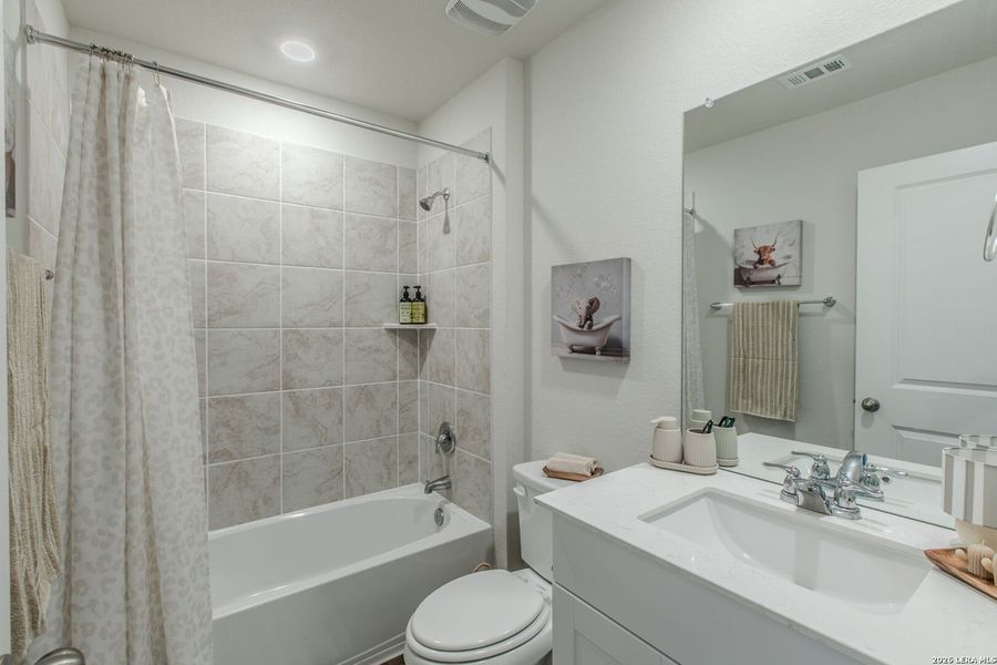 Furnished interior view inside a new home in The Links at River Bend, Floresville (Image 10).