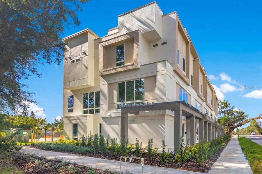 Front exterior of a new home in , Orlando, FL, highlighting curb appeal (Image 28).