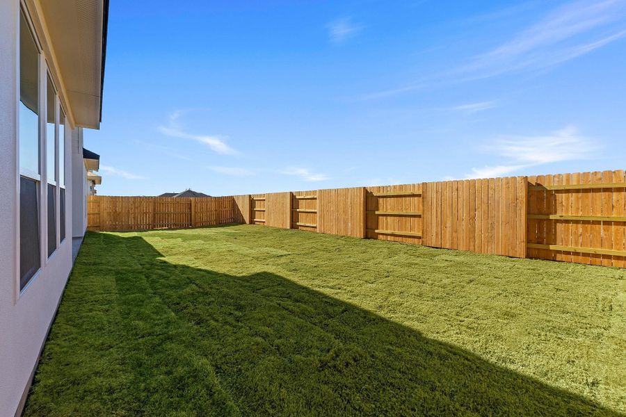 Exterior details and patio area of a home in Lariat, Liberty Hill (Image 27).