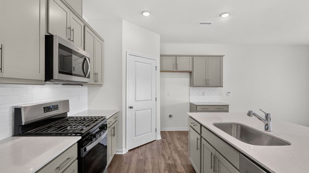 Furnished interior view inside a new home in The Grove at Matthews Landing, Fuquay Varina (Image 5).