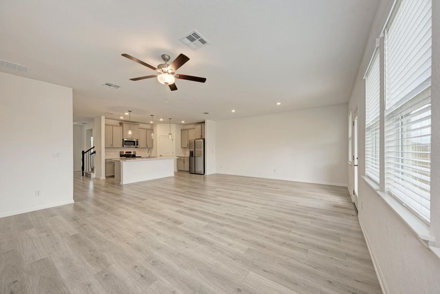 An open floorplan seamlessly connects the living area and kitchen, perfect for modern lifestyles.