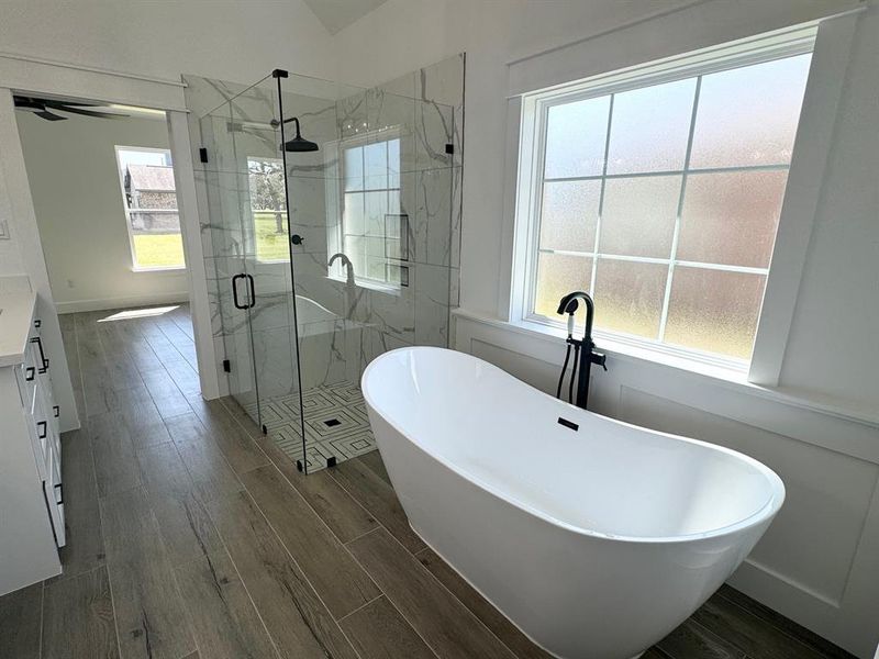 Back wall of windows to an open floor plan with a view of the green space (former golf course)