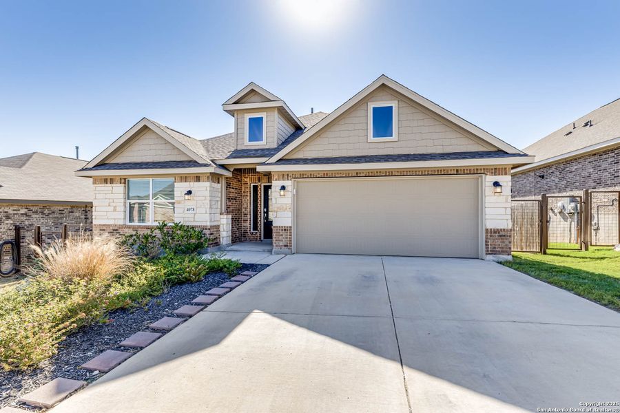 Front exterior of a new home in Johnson Ranch: Brookstone II Collection, Bulverde, TX, highlighting curb appeal (Image 2).