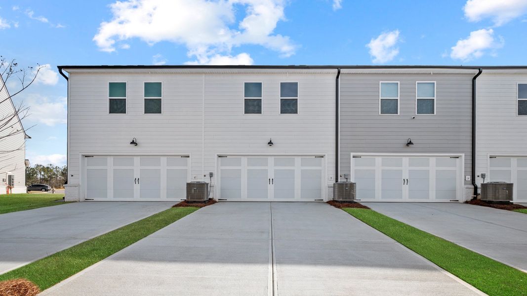 Front exterior of a new home in Echo Glen, Stockbridge, GA, highlighting curb appeal (Image 2).