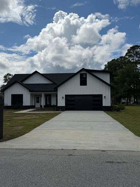 Front exterior of a new home in , Jesup, GA, highlighting curb appeal (Image 16).