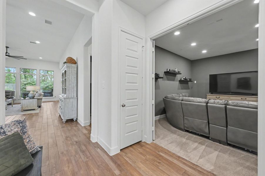 Off the entry, and past the study, is this media room. The double doors are solid and the room carpeted for sound control. There are two closets on either side of the doors for storage. Off the entry, and past the study, is this media room. The double doors are solid and the room carpeted for sound control. There are two closets on either side of the doors for storage.