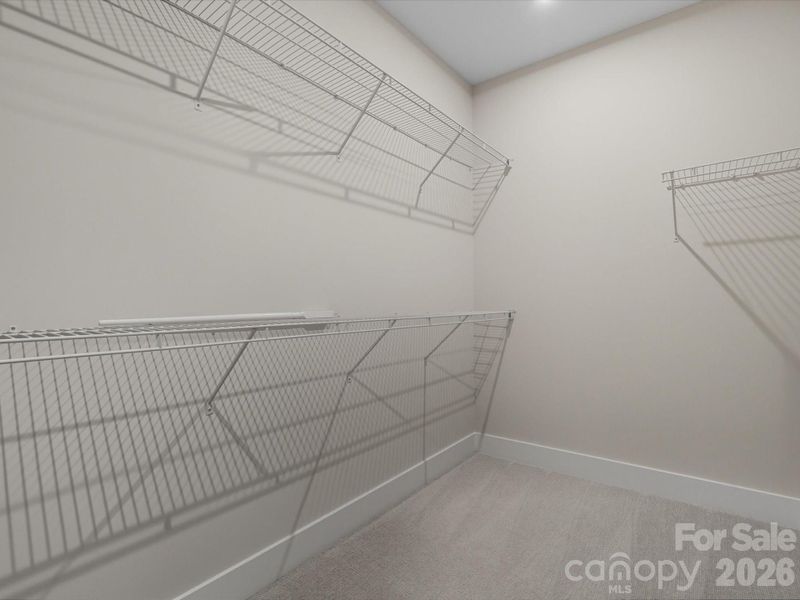 Primary walk-in closet Primary walk-in closet