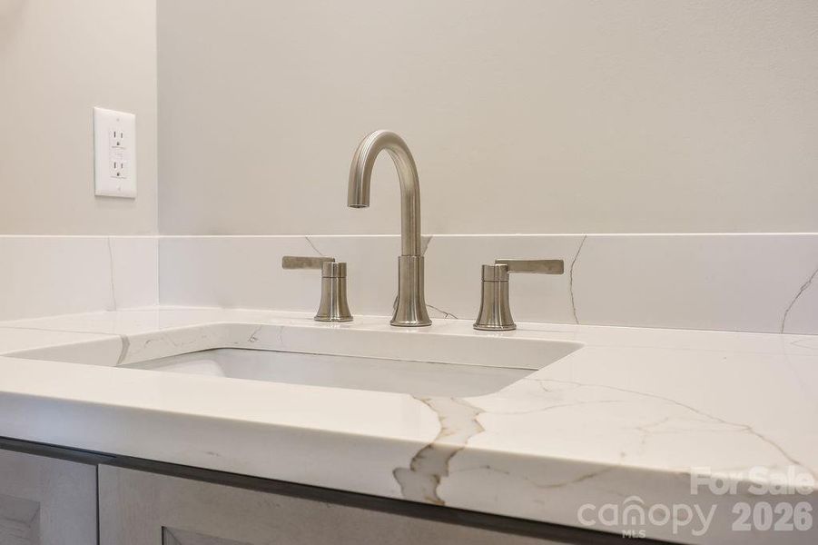Quartz countertops in all bathrooms.