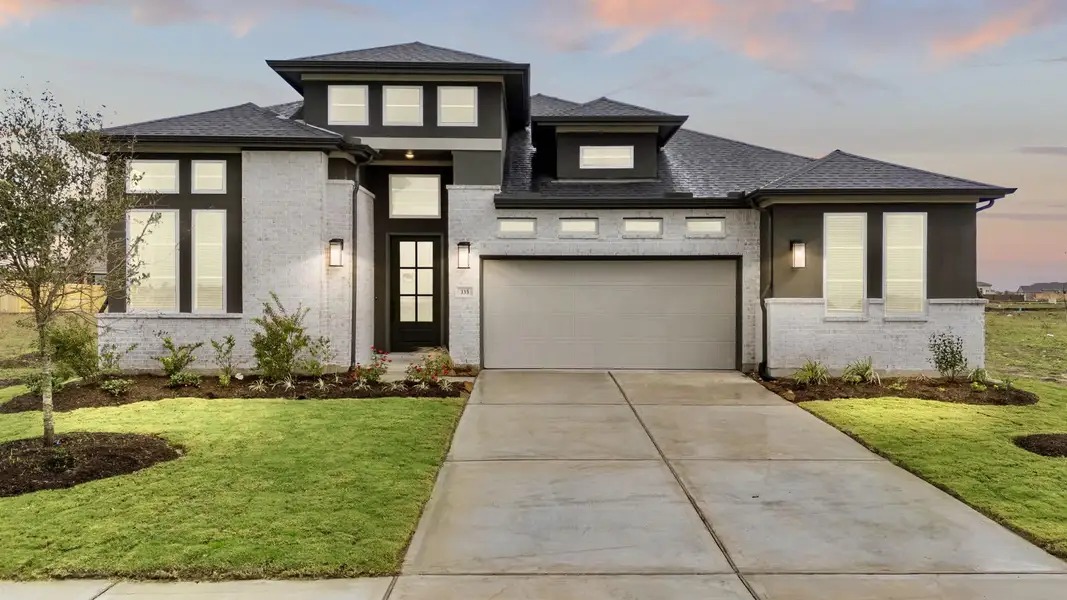 Front exterior of a new home in Brookewater, Rosenberg, TX, highlighting curb appeal (Image 2).
