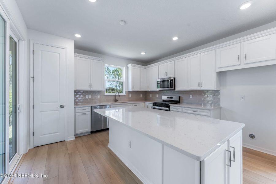 Furnished interior view inside a new home in Del Webb Wildlight, Yulee (Image 7).