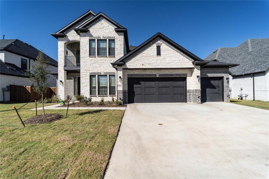 Front exterior of a new home in Sonoma Verde, Rockwall, TX, highlighting curb appeal (Image 2).