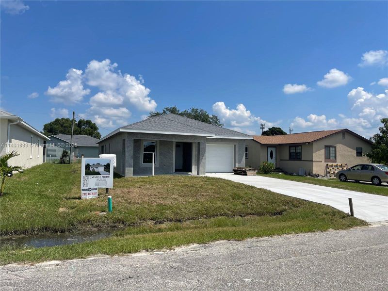Front exterior of a new home in , Fort Myers, FL, highlighting curb appeal (Image 12).