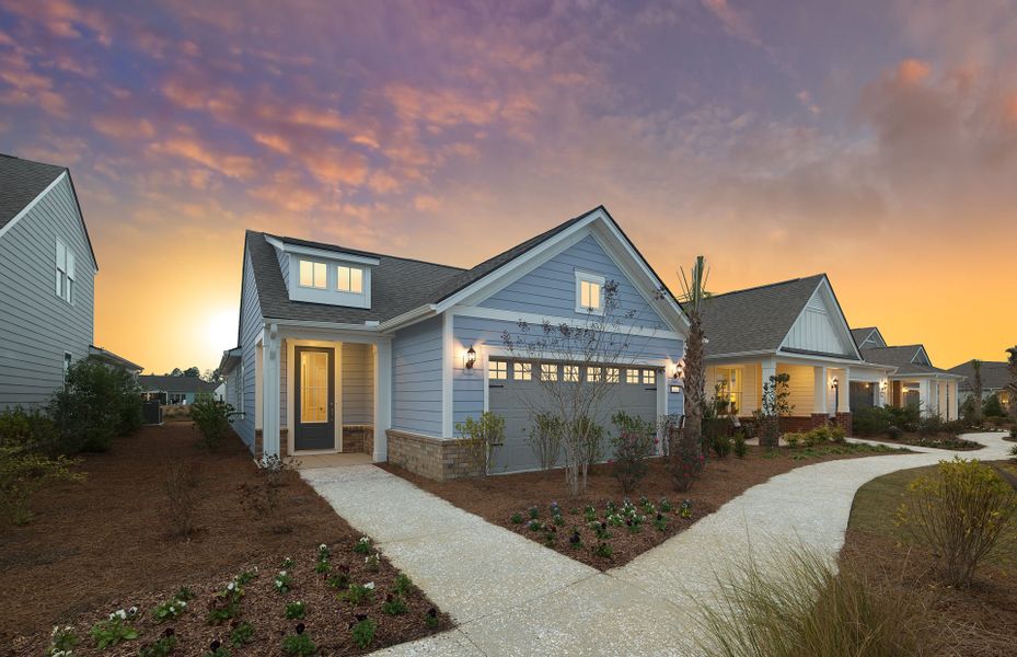 Front exterior of a new home in Del Webb Savannah at Heartwood, Richmond Hill, GA, highlighting curb appeal (Image 29). Front exterior of a new home in Del Webb Savannah at Heartwood, Richmond Hill, GA, highlighting curb appeal (Image 29).